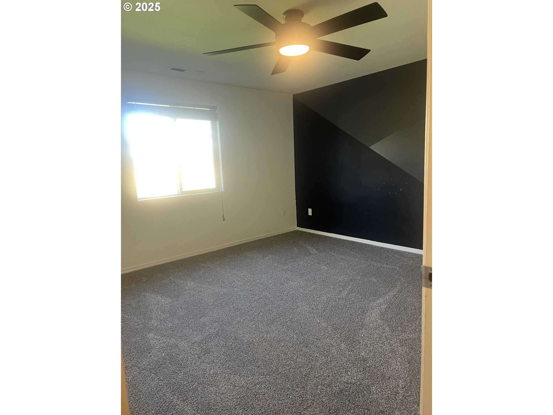 5752 Mica Street Springfield, OR 97478 - Photo 18 of 45 a view of an empty room with a window