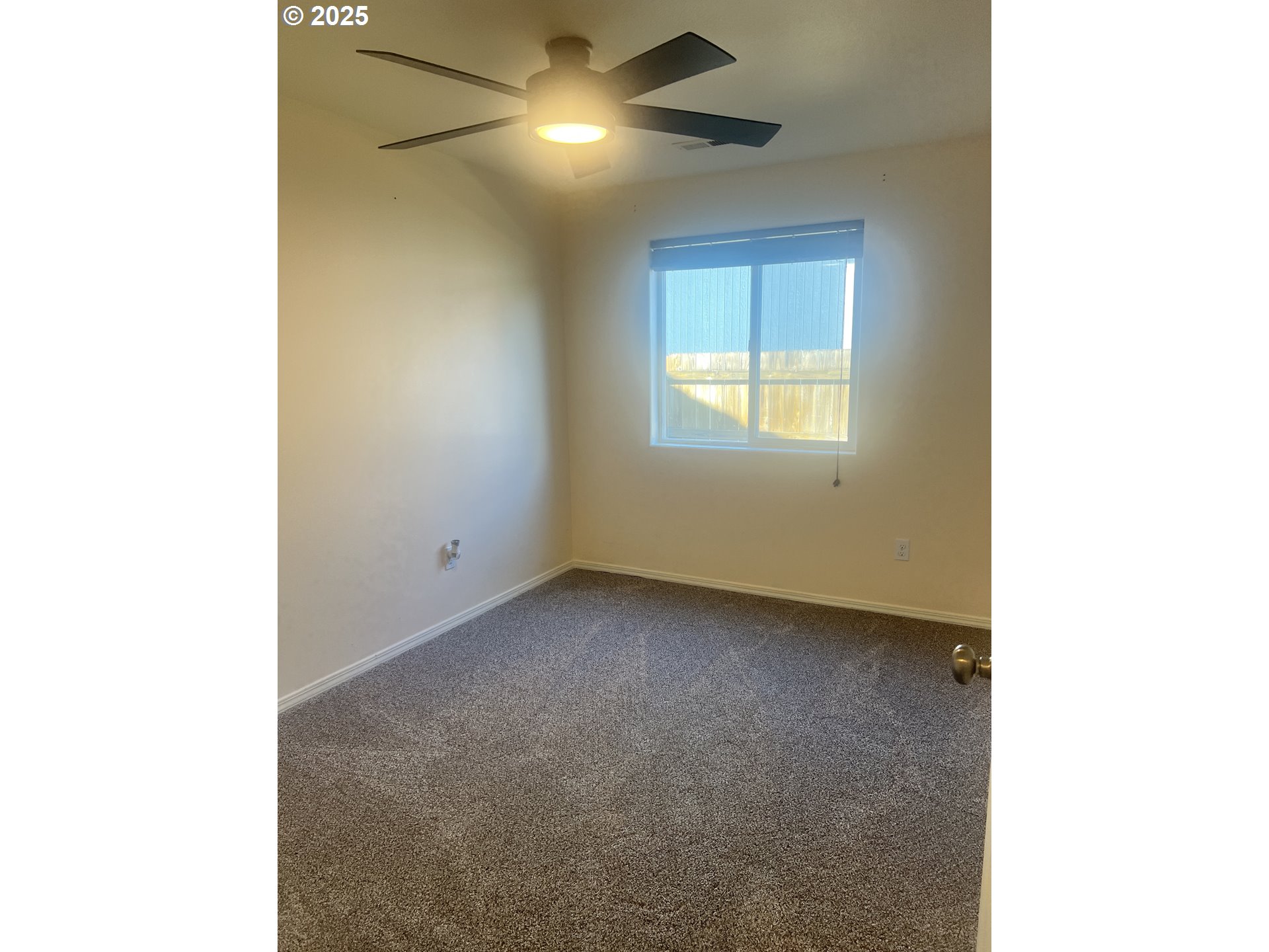 5752 Mica Street Springfield, OR 97478 - Photo 25 of 45 a view of an empty room with a window