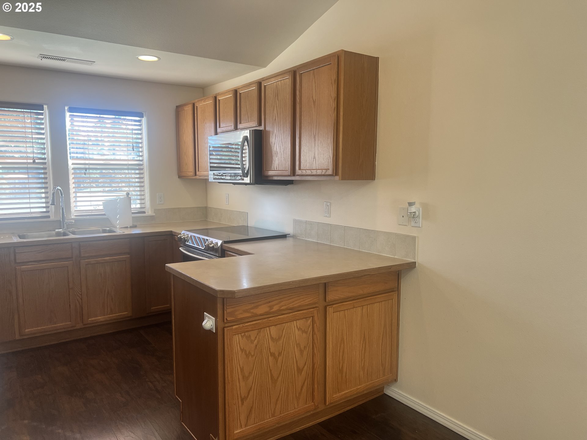 5752 Mica Street Springfield, OR 97478 - Photo 10 of 45 a kitchen with a sink cabinets and a window