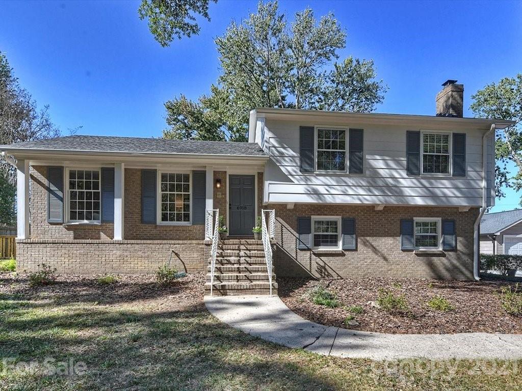 6918 Windyrush Road Charlotte, NC 28226 - Photo 1 of 26 front view of house with a yard