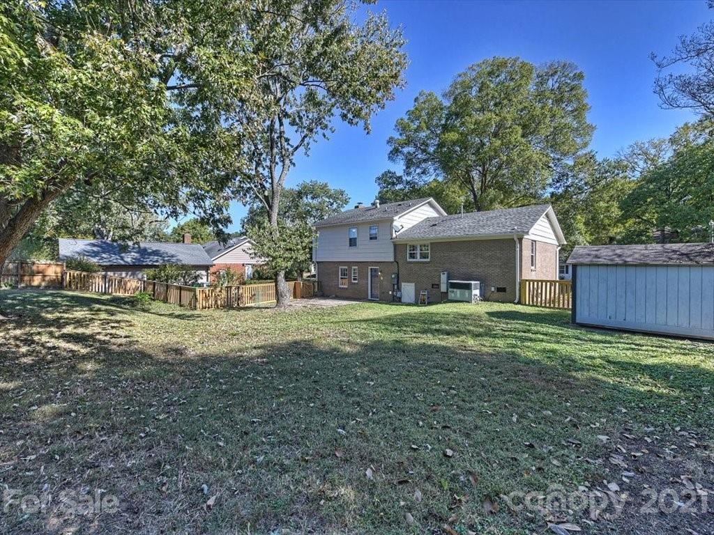 6918 Windyrush Road Charlotte, NC 28226 - Photo 24 of 26 a front view of a house with a garden