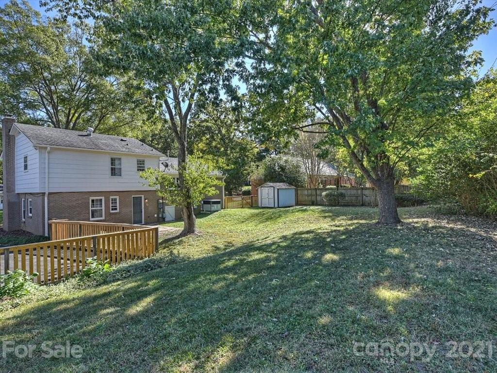 6918 Windyrush Road Charlotte, NC 28226 - Photo 25 of 26 a front view of a house with a yard