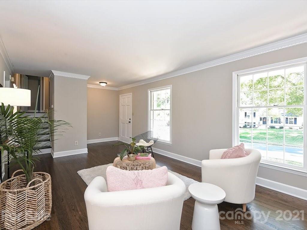 6918 Windyrush Road Charlotte, NC 28226 - Photo 5 of 26 a living room with furniture and a large window