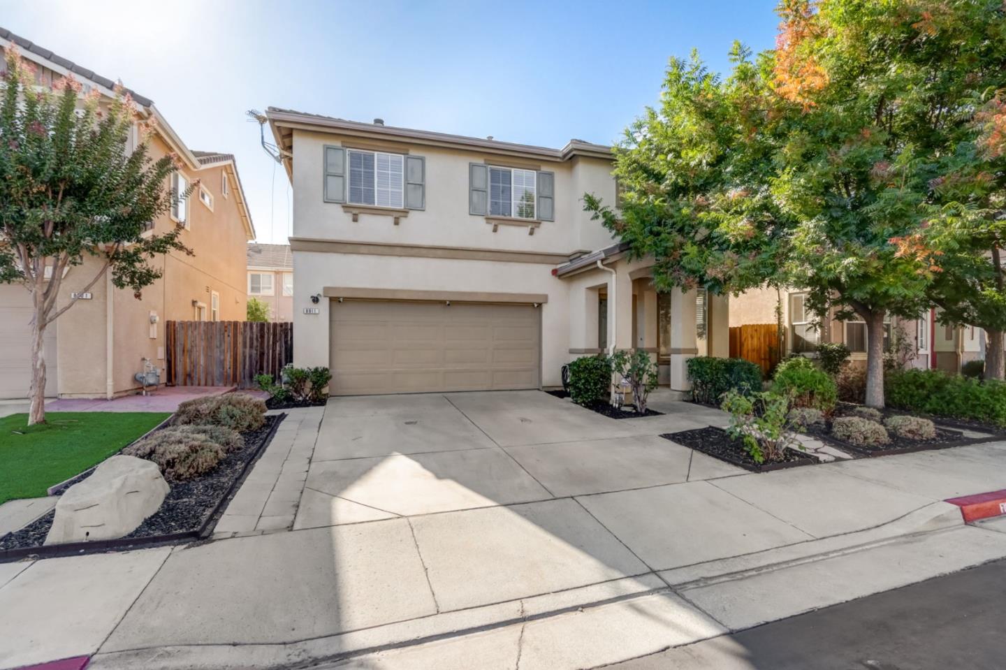 8911 Del Rio Circle Gilroy, CA 95020 - Photo 2 of 29 a front view of a house with garden