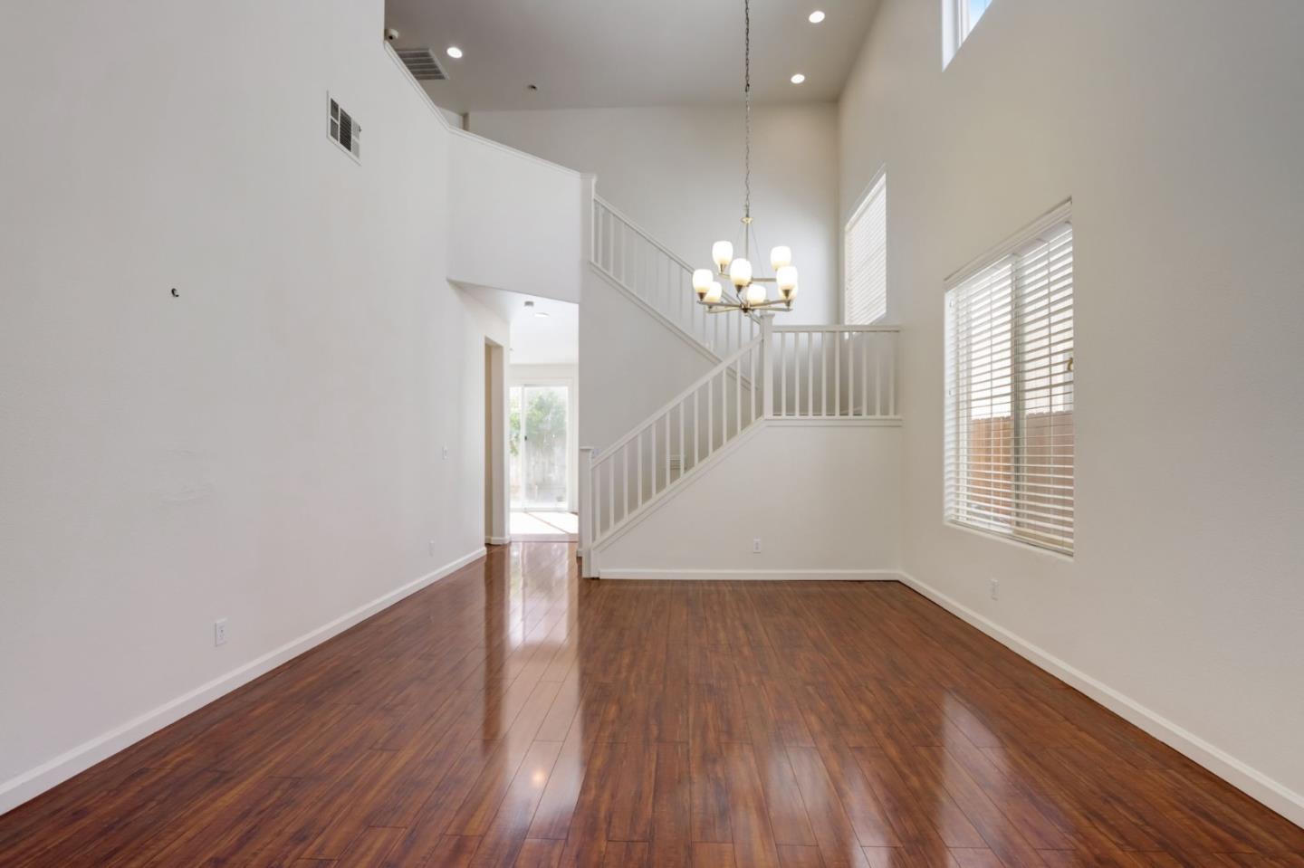 8911 Del Rio Circle Gilroy, CA 95020 - Photo 6 of 29 wooden floor in an empty room with a window