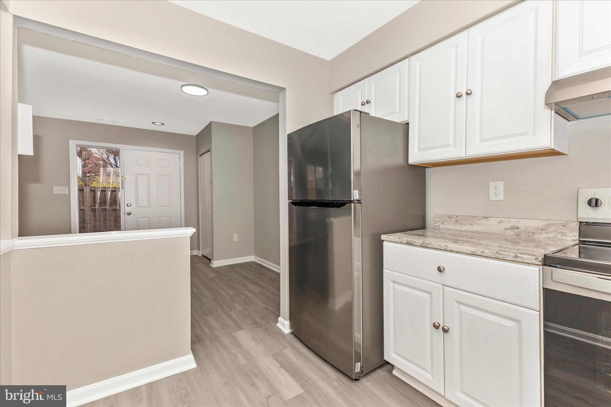 2861 Shepperton Terrace Silver Spring, MD 20904 - Photo 16 of 44 a kitchen with stainless steel appliances granite countertop a refrigerator and a stove