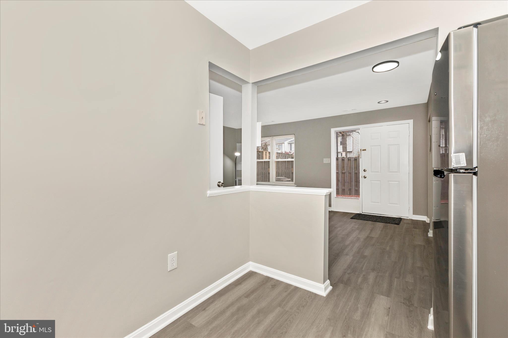 2861 Shepperton Terrace Silver Spring, MD 20904 - Photo 17 of 44 an empty room with wooden floor and windows
