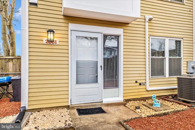 a view of a door and a window