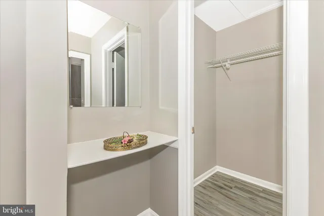 a bathroom with a granite countertop sink and toilet