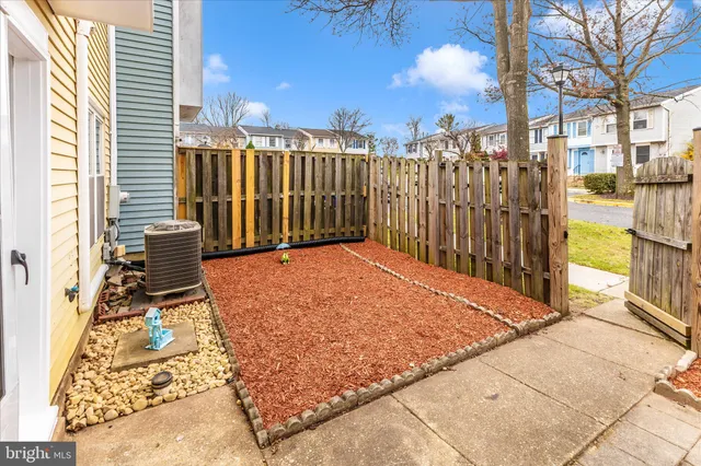 a view of balcony with wooden floor and fence