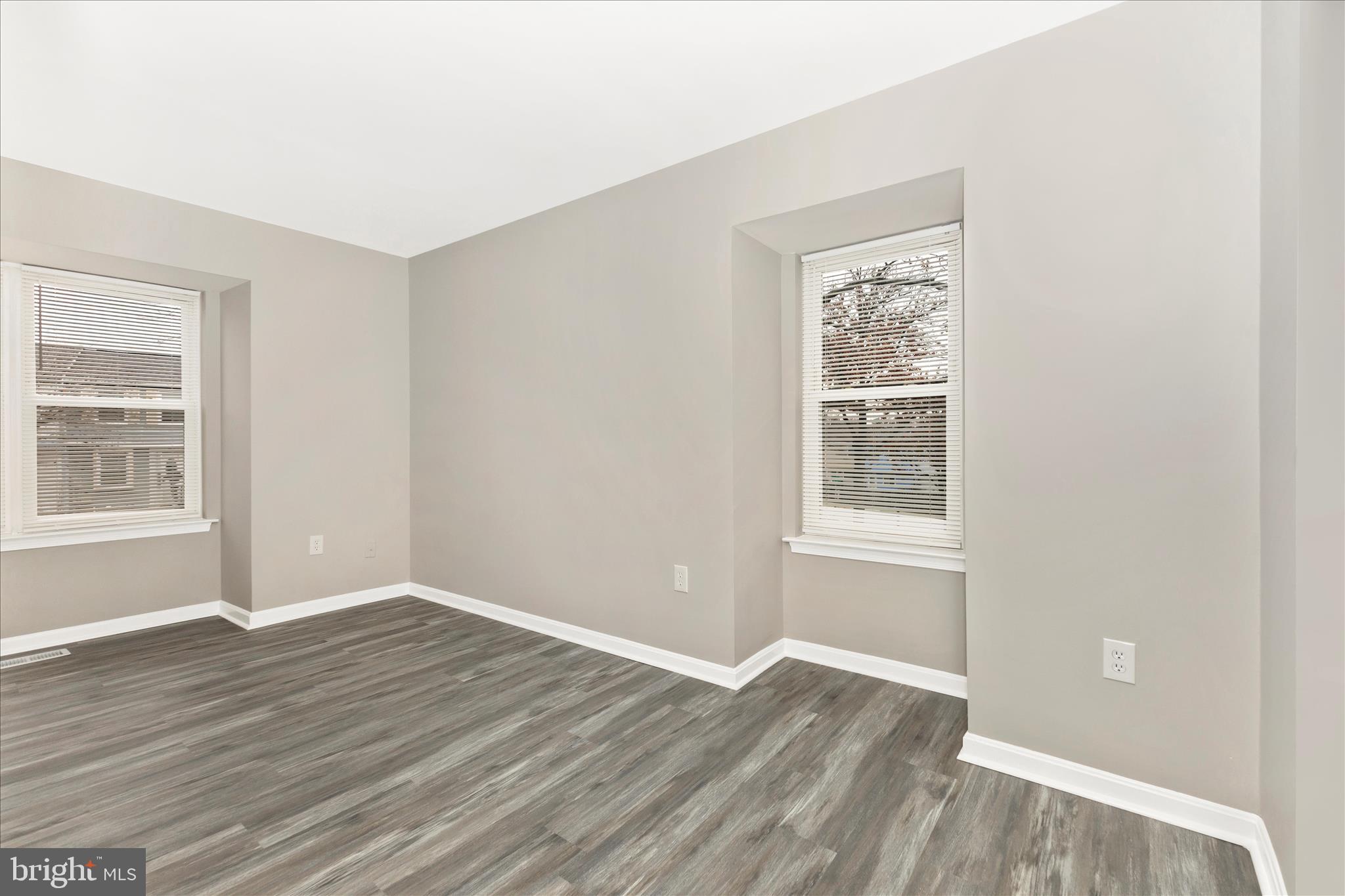 2861 Shepperton Terrace Silver Spring, MD 20904 - Photo 4 of 44 a view of an empty room with wooden floor and a window
