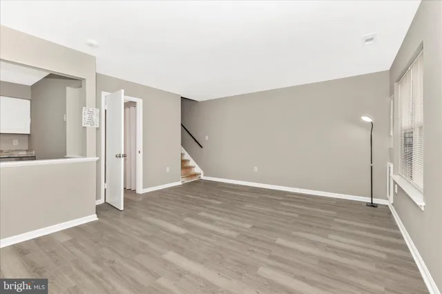 a view of a livingroom with wooden floor