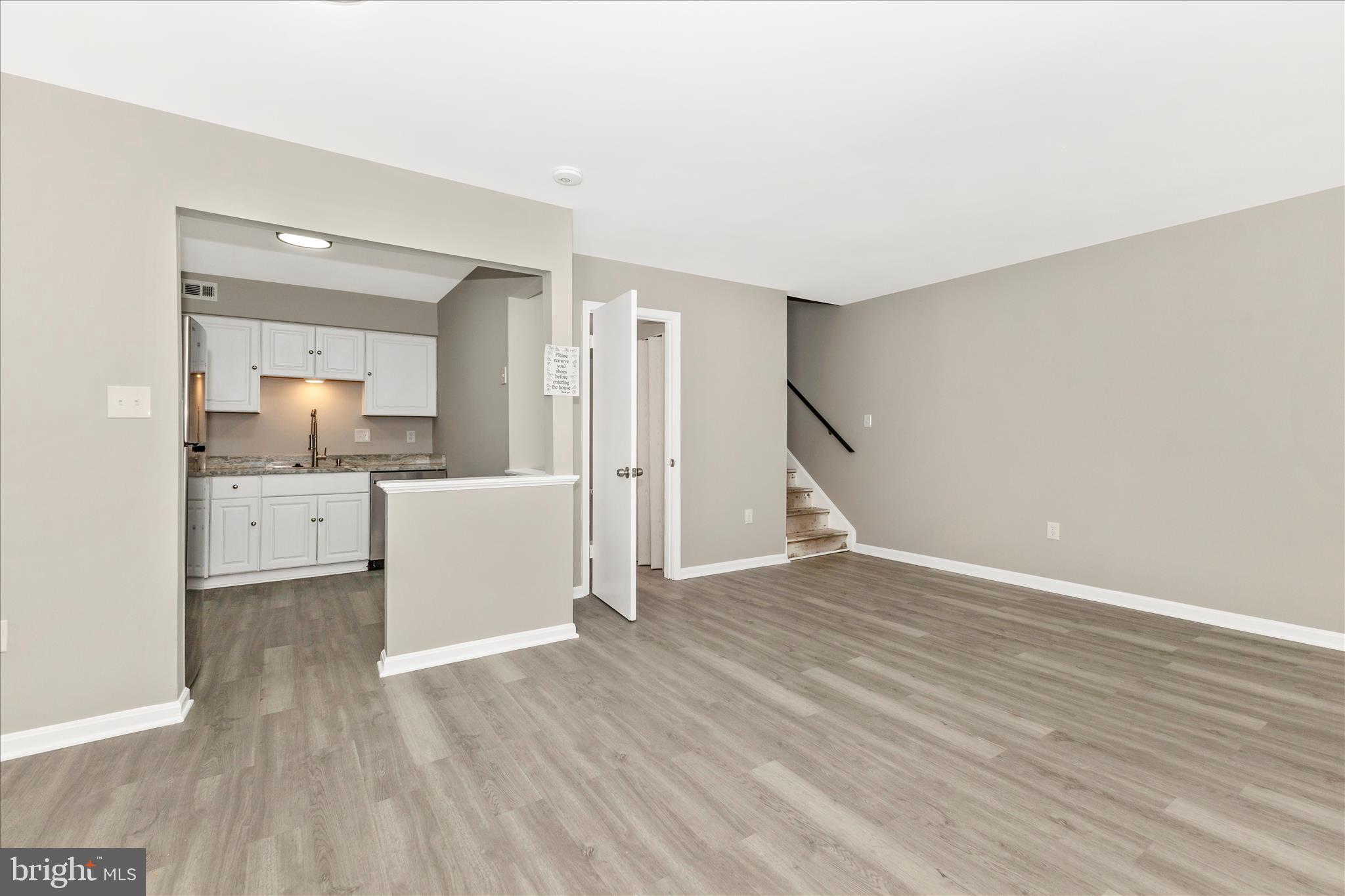 2861 Shepperton Terrace Silver Spring, MD 20904 - Photo 10 of 44 a view of a kitchen with wooden floor and a sink