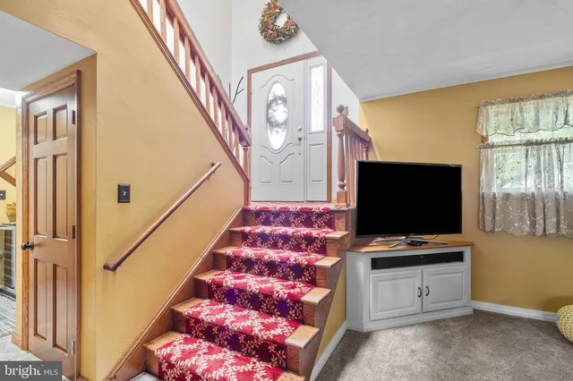 a workspace with furniture and a flat screen tv