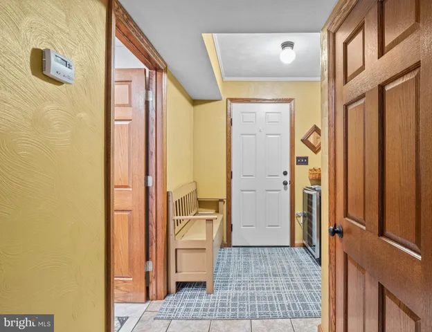 a bathroom with a glass door shower and a sink