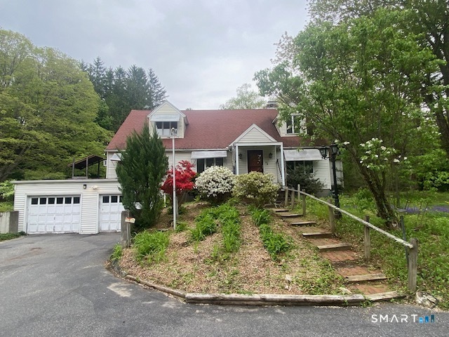 33 Flanders Road Bethlehem, CT 06751 - Photo 1 of 18 front view of a house with a yard