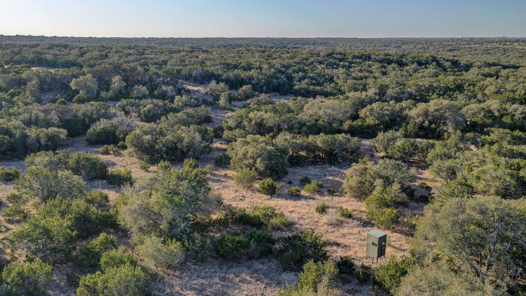 870 Rocky Top Road Southwest Hunt, TX 78024 - Photo 55 of 63 an aerial view of house with yard and green space