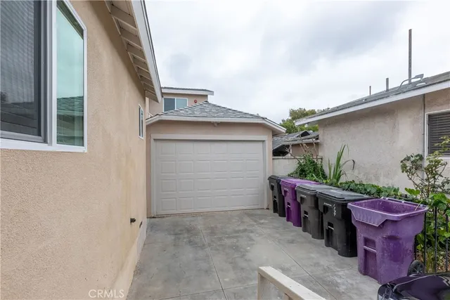 a view of a porch with potted plants