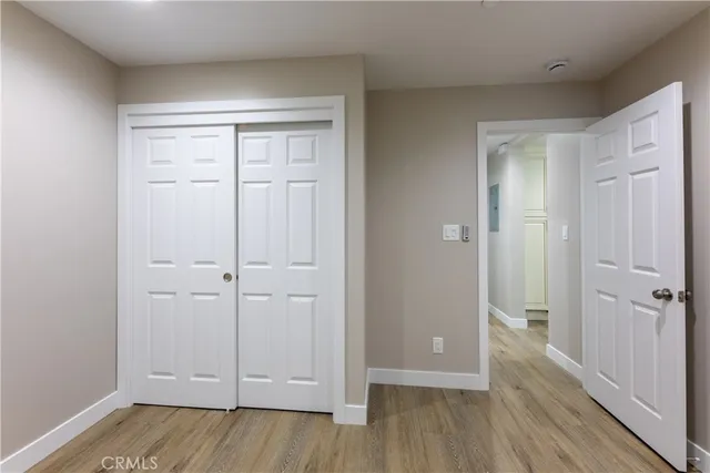 an empty room with wooden floor