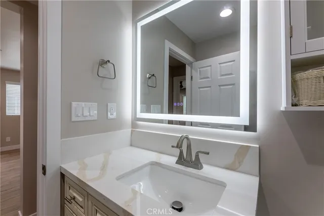a bathroom with a sink and a window