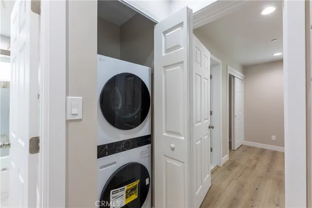 a view of a hallway with washer and dryer