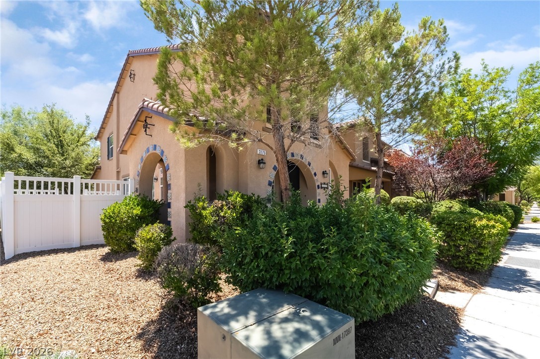3175 Via Seranova Henderson, NV 89044 - Photo 3 of 45 This residence features a charming exterior with inviting arches and lush landscaping.
