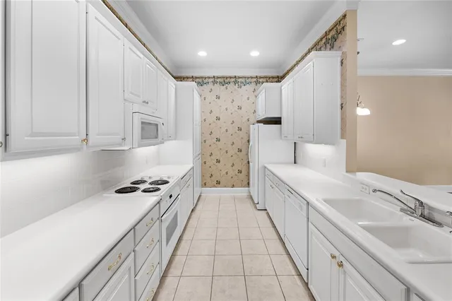 a spacious bathroom with a double vanity sink a mirror and a shower