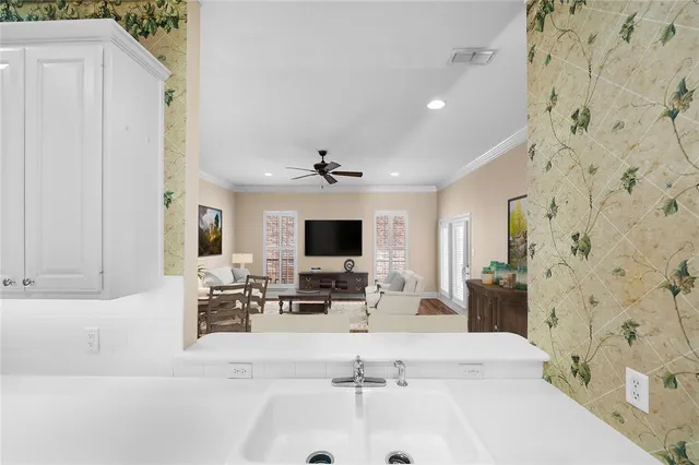 a living room with fireplace furniture and a flat screen tv