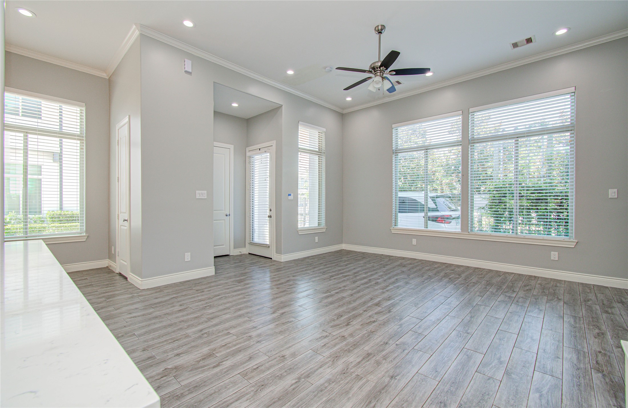 8903 Spring Knoll Forest Drive Houston, TX 77080 - Photo 17 of 29 wooden floor in an empty room with a window