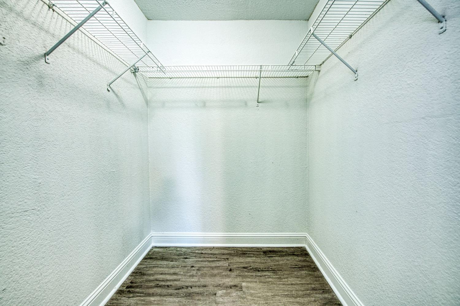 2881 Huntington Boulevard, Unit 262 Fresno, CA 93721 - Photo 27 of 31 a view of a room with racks on the wall