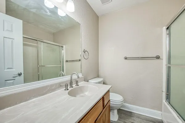 a view of porch with wooden floor