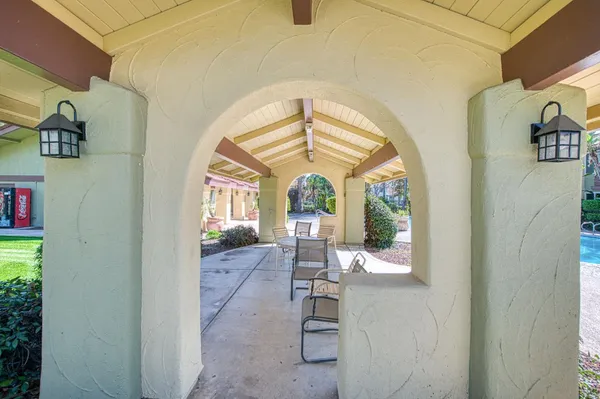 a view of a porch with furniture and a window