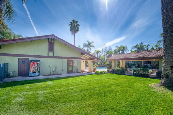 a front view of house with yard and green space