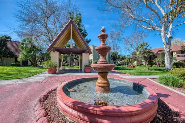 a view of a fountain in the garden