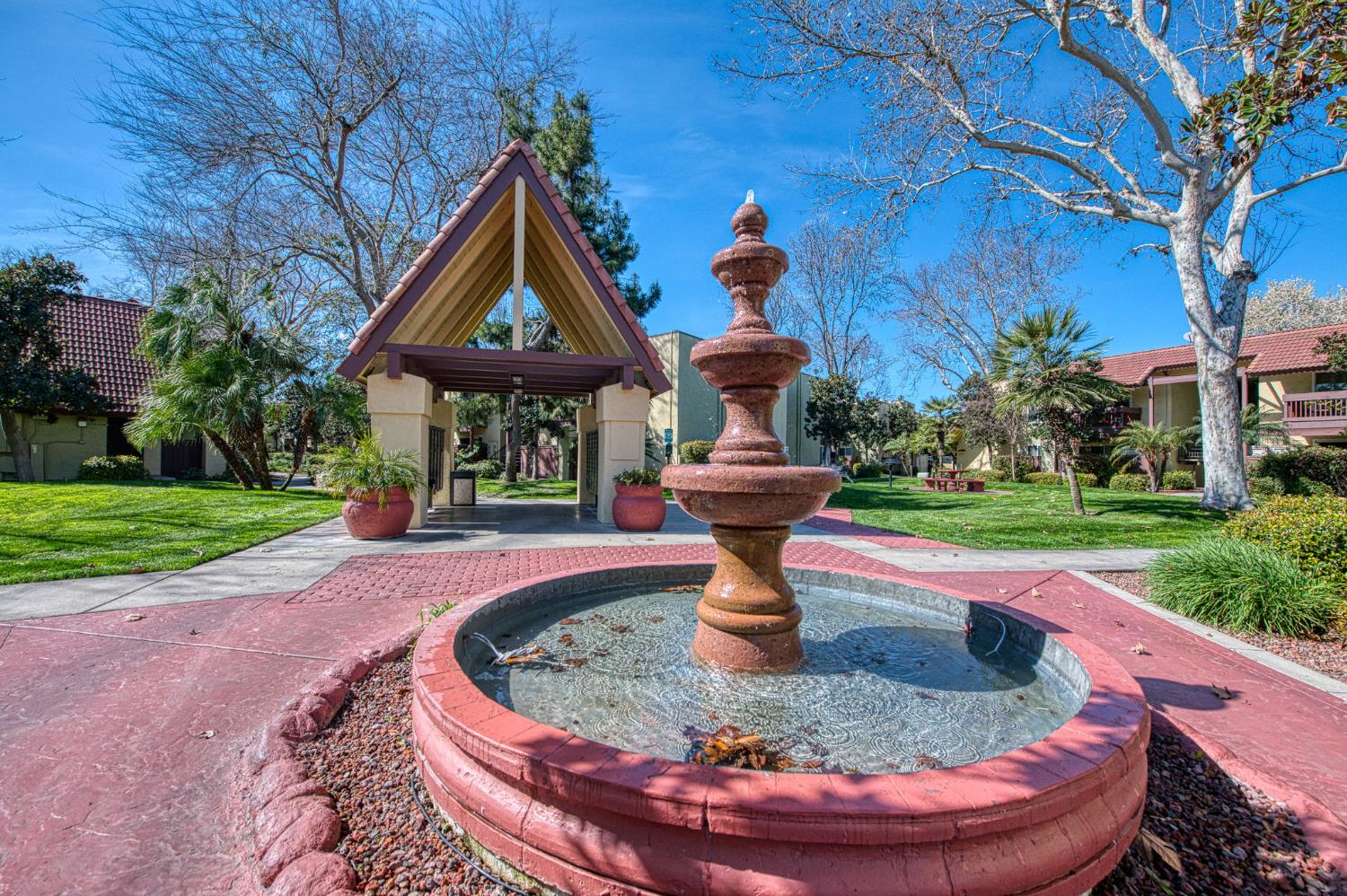 2881 Huntington Boulevard, Unit 262 Fresno, CA 93721 - Photo 7 of 31 a view of a fountain in the garden