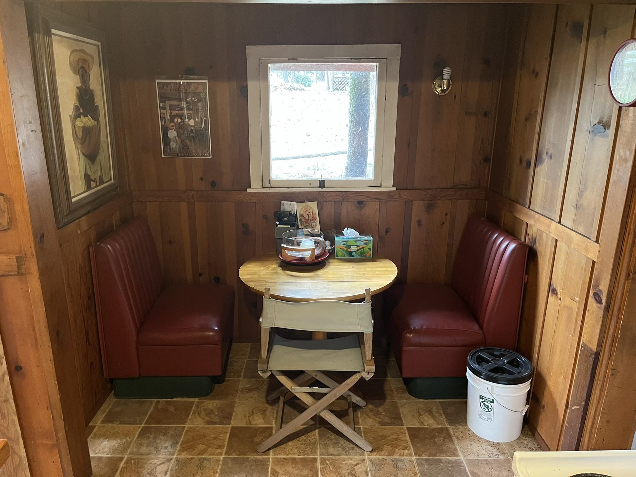 23090 North Bald Mountain Road Sonora, CA 95370 - Photo 11 of 59 Dining room featuring stone finish floors and wood walls