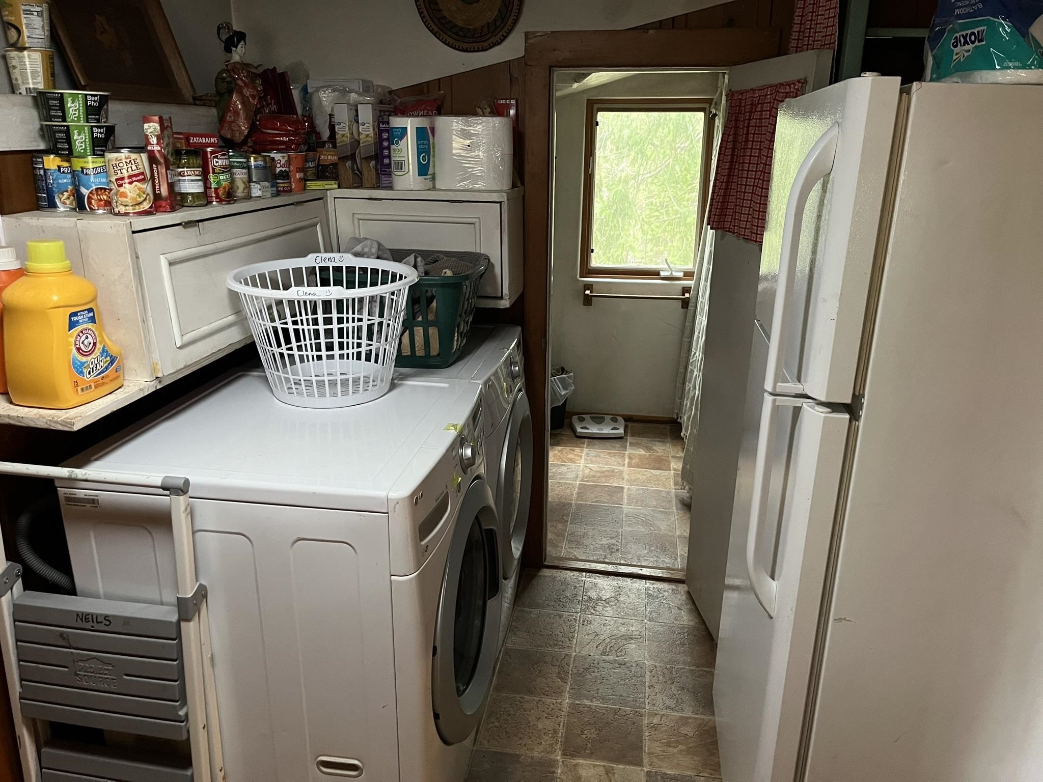 23090 North Bald Mountain Road Sonora, CA 95370 - Photo 14 of 59 Laundry area with stone tile flooring and washer and dryer