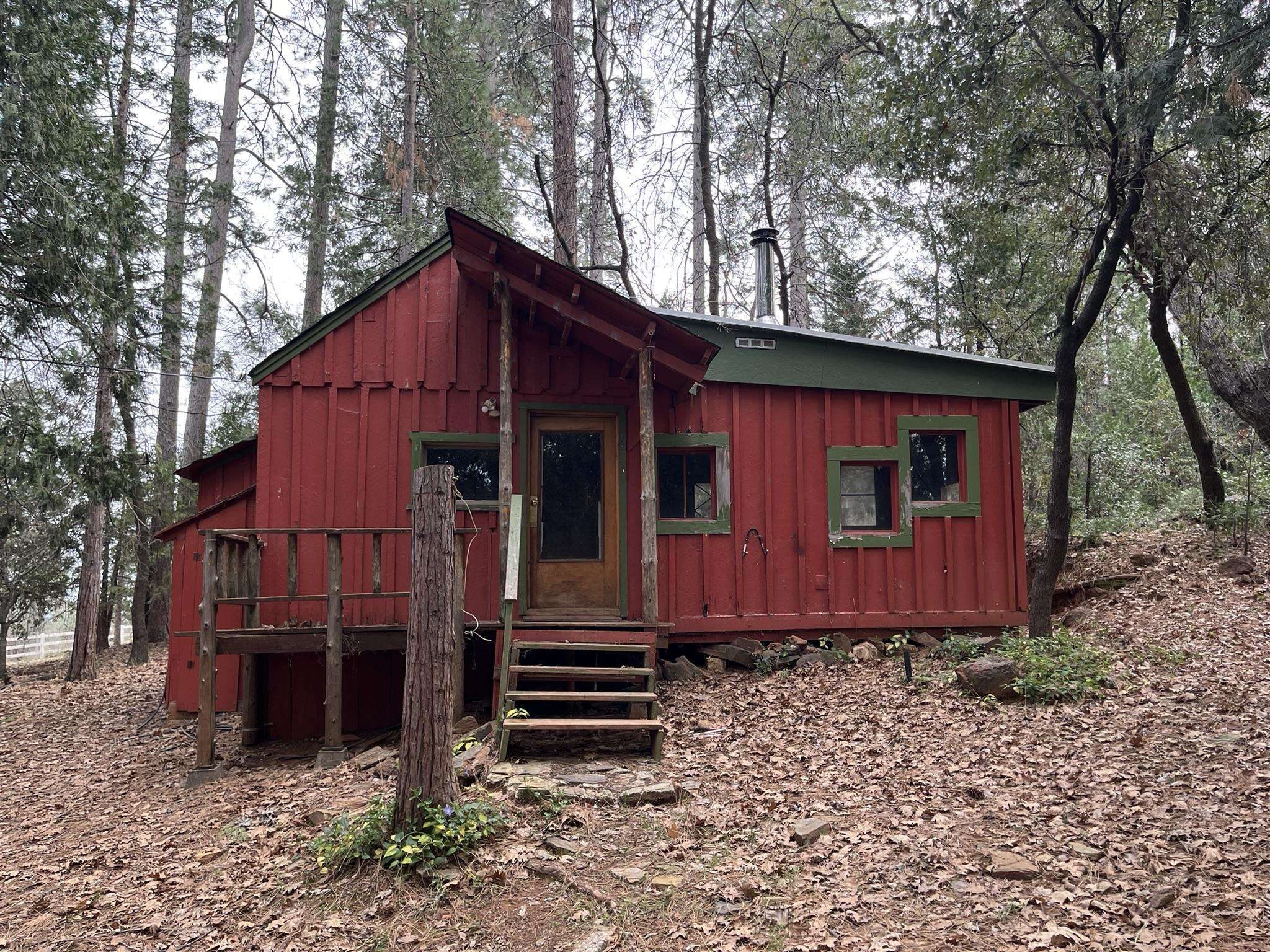 23090 North Bald Mountain Road Sonora, CA 95370 - Photo 34 of 59 View of front of home with board and batten siding and a wooden deck