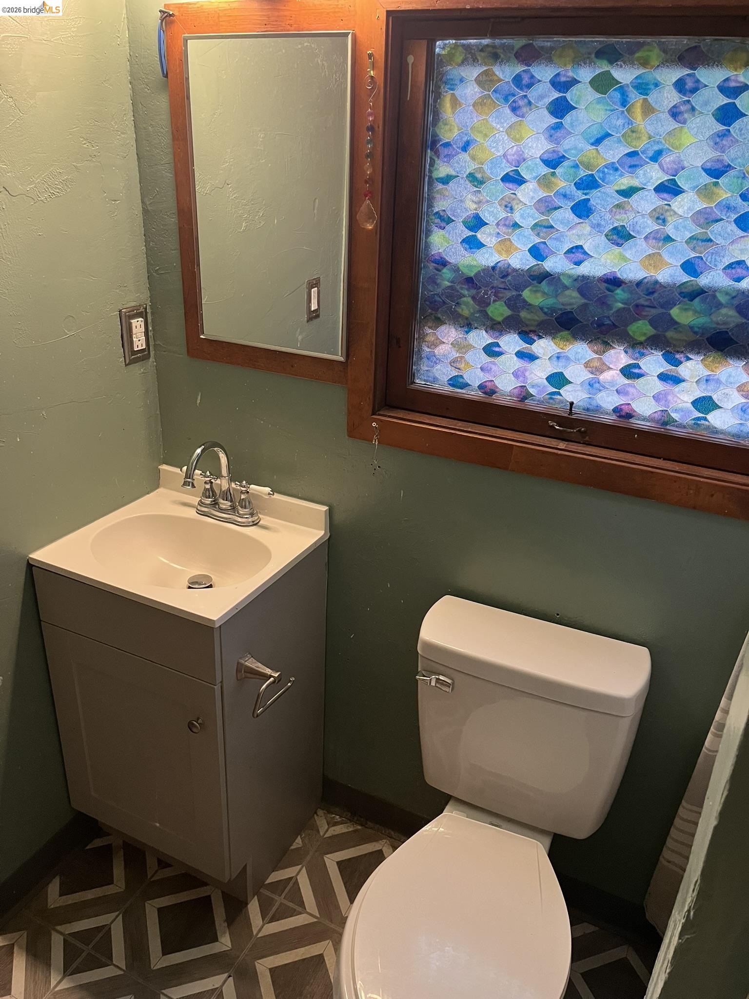 23090 North Bald Mountain Road Sonora, CA 95370 - Photo 35 of 59 a bathroom with a toilet sink and mirror