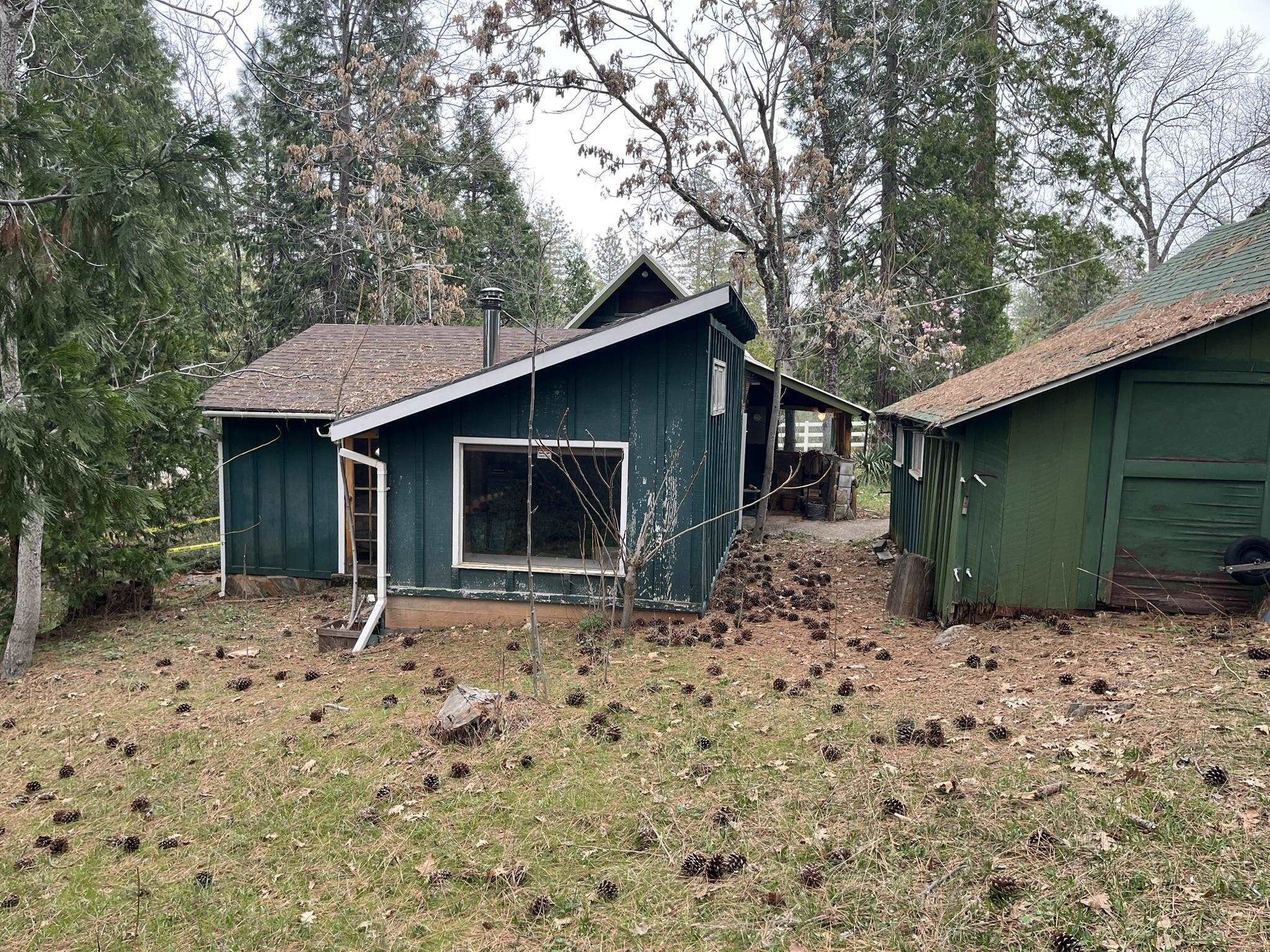23090 North Bald Mountain Road Sonora, CA 95370 - Photo 54 of 59 Back of house featuring board and batten siding