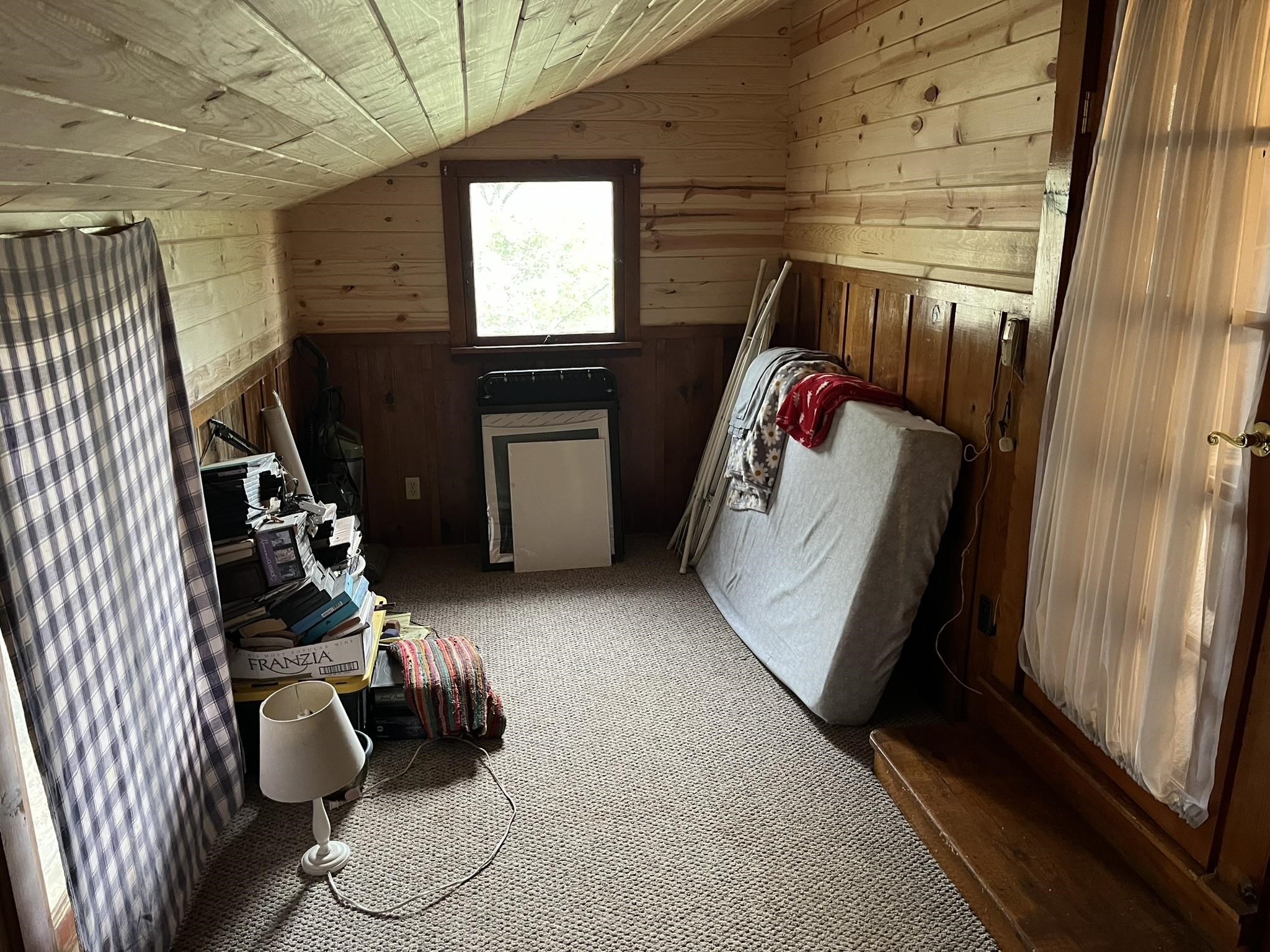 23090 North Bald Mountain Road Sonora, CA 95370 - Photo 9 of 59 Bedroom with wooden walls, light carpet, and a vaulted wooden ceiling