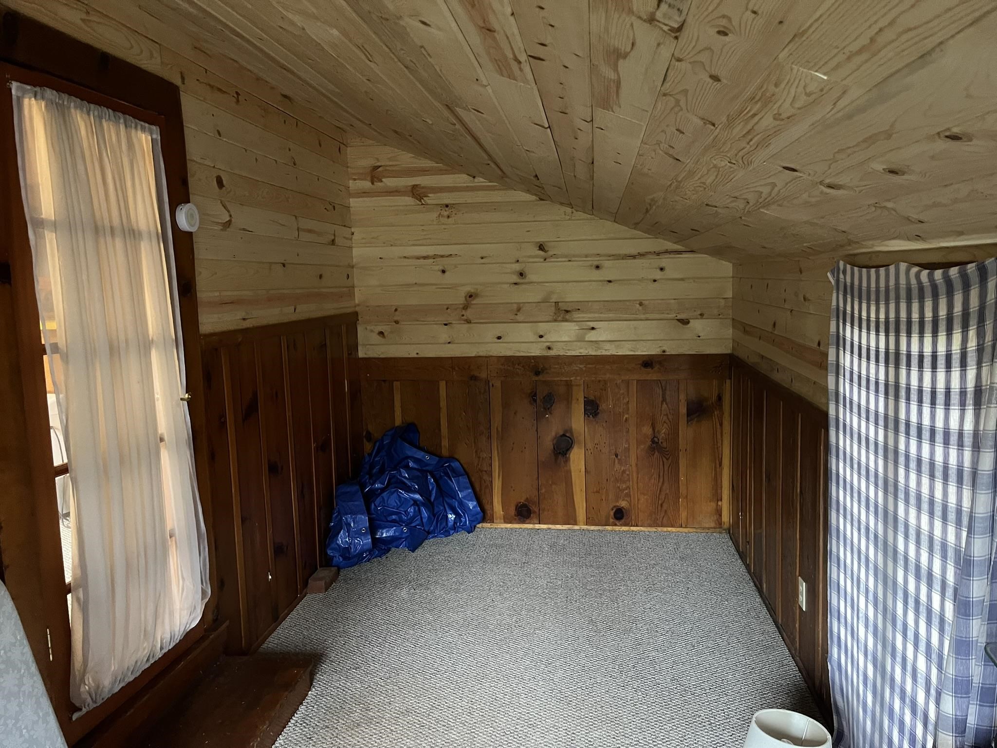 23090 North Bald Mountain Road Sonora, CA 95370 - Photo 10 of 59 Bonus room featuring wooden walls, a vaulted wooden ceiling, and carpet
