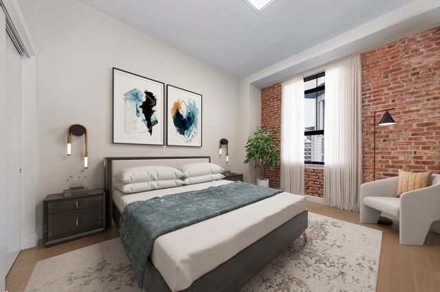 a spacious bedroom with a large bed and a couch