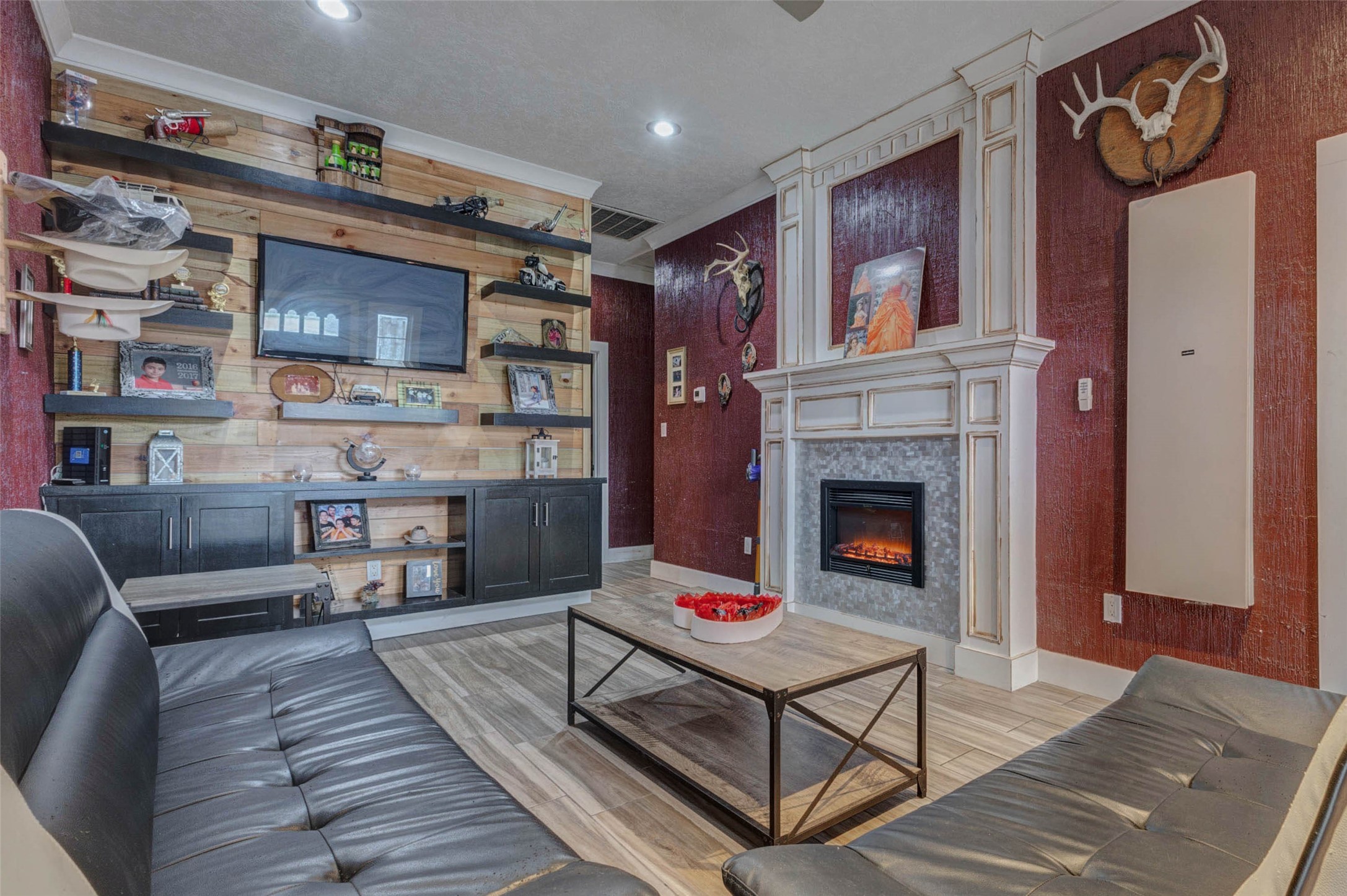 4008 Colvin Street Houston, TX 77013 - Photo 13 of 28 a living room with furniture and a fireplace