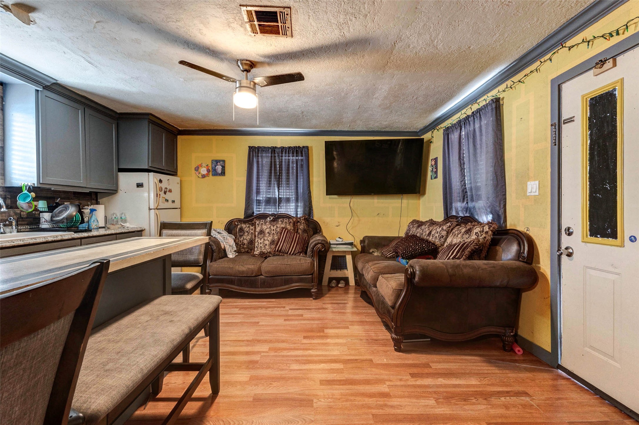 4008 Colvin Street Houston, TX 77013 - Photo 20 of 28 a living room with furniture and a flat screen tv