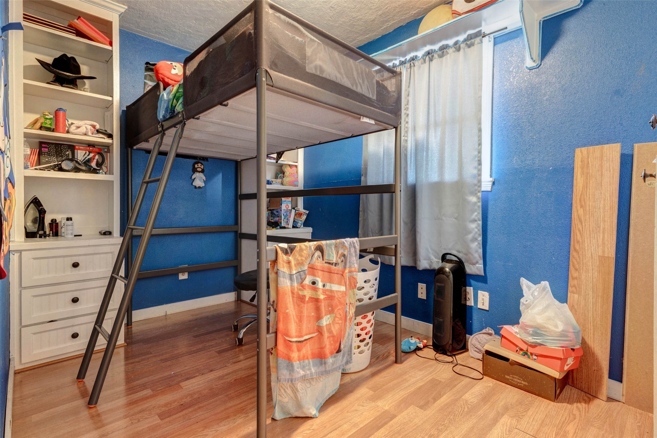 4008 Colvin Street Houston, TX 77013 - Photo 23 of 28 a view of a bedroom with furniture and wooden floor