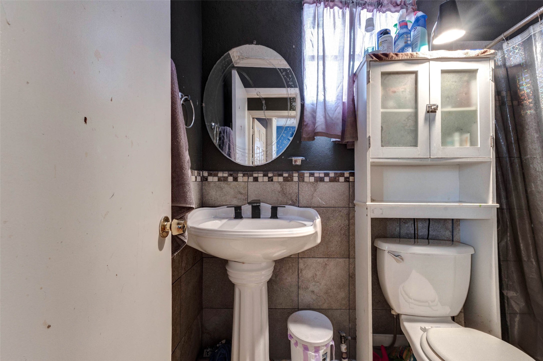 4008 Colvin Street Houston, TX 77013 - Photo 24 of 28 a bathroom with a toilet sink and mirror