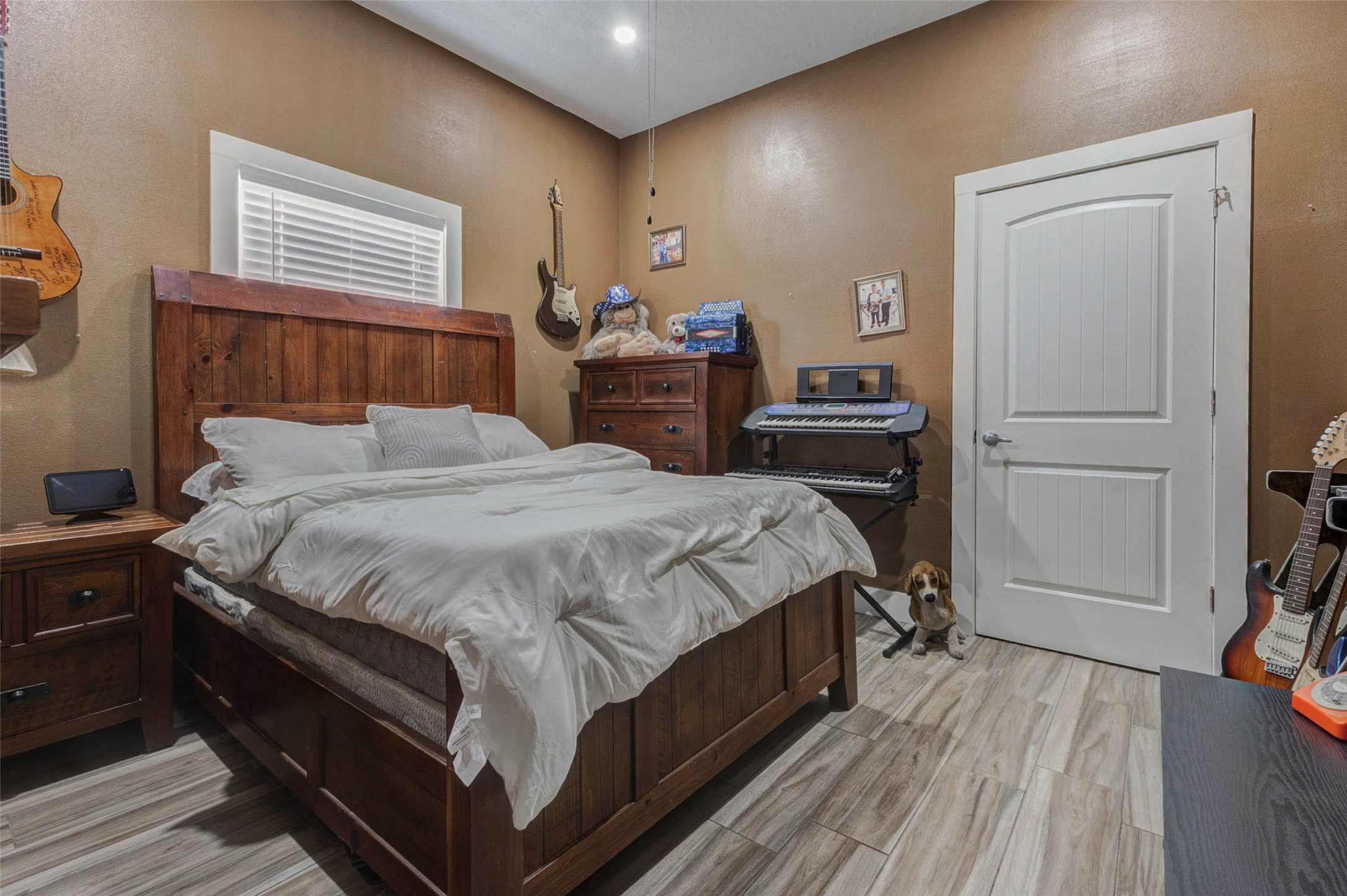 4008 Colvin Street Houston, TX 77013 - Photo 3 of 28 a bed room with a bed and a television