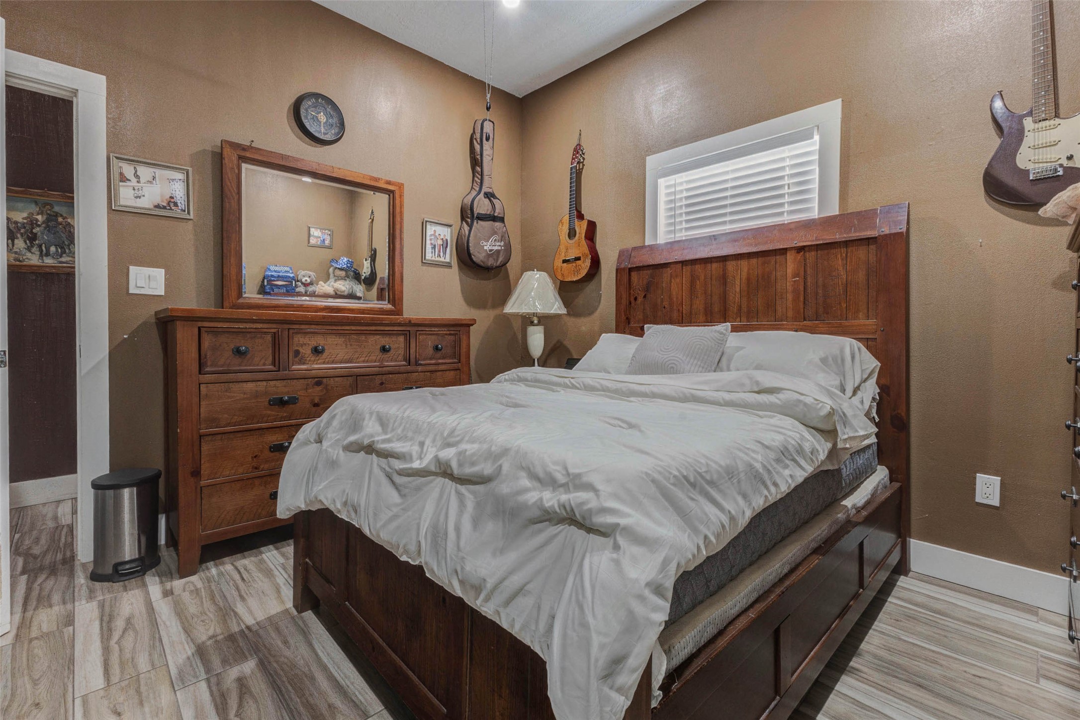 4008 Colvin Street Houston, TX 77013 - Photo 5 of 28 a bedroom with a bed and a dresser