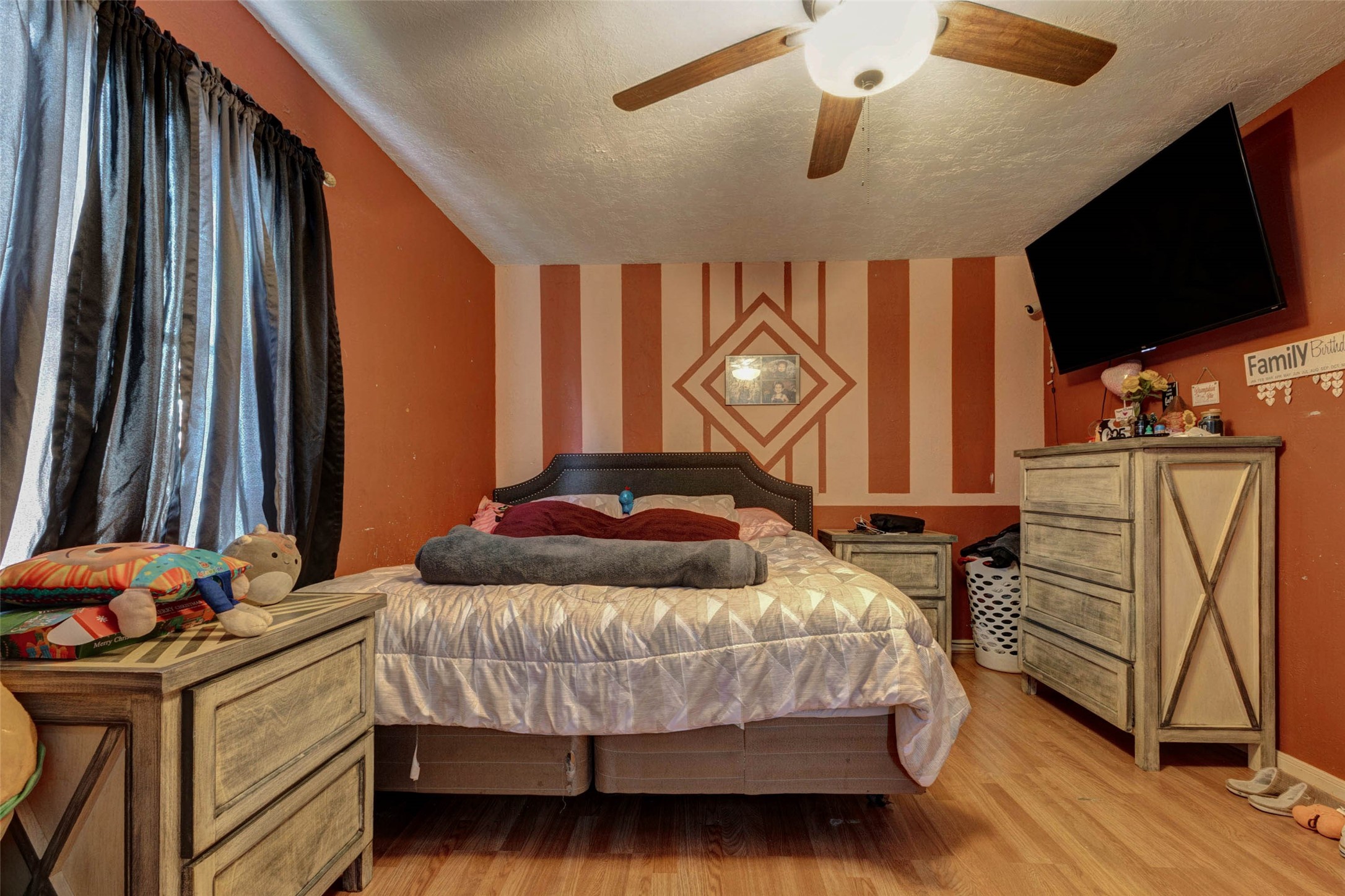 4008 Colvin Street Houston, TX 77013 - Photo 8 of 28 a bedroom with a bed window and a flat screen tv